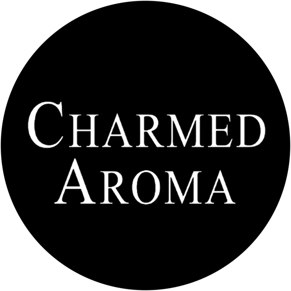 Interior Design - Logo of Charmed Aroma displayed in a simple white font on a black background. Dexign Matter Studio