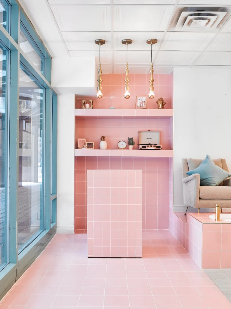 Interior Design - Interior space featuring pink tiled walls, a light fixture, and a seating area with a sofa. Dexign Matter Studio
