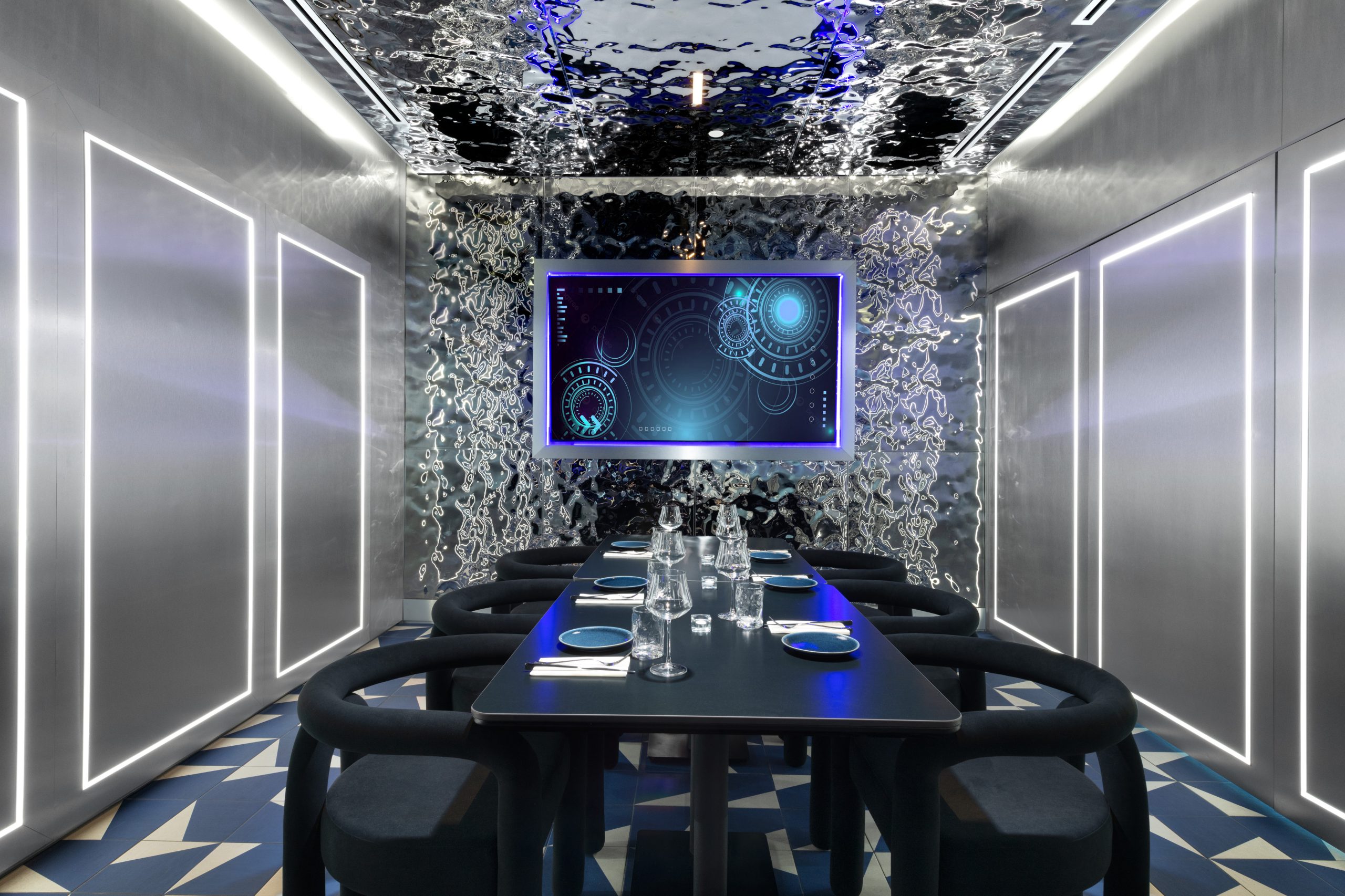 Interior Design - Contemporary dining room featuring a digital display and unique ceiling design. Dexign Matter Studio