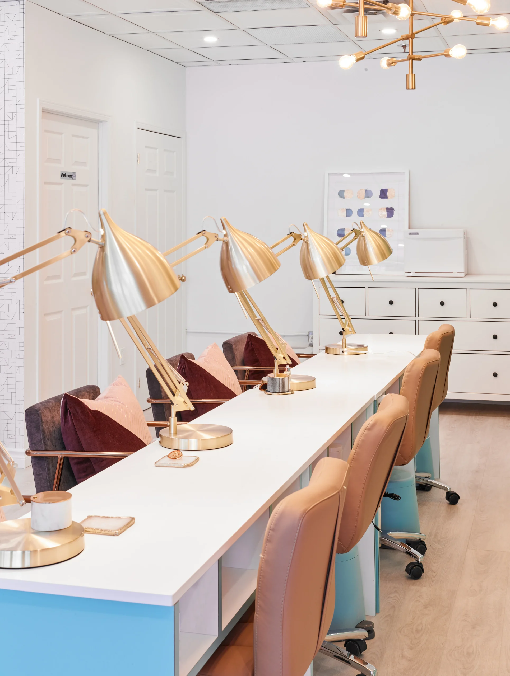 Interior Design - Interior view of a nail salon featuring task lighting and seating arrangements. Dexign Matter Studio