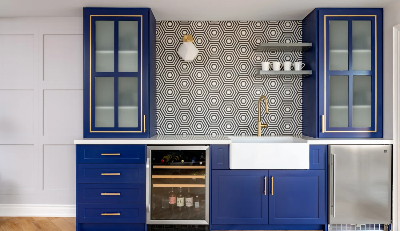 Interior Design - Modern kitchen featuring blue cabinets, a hexagonal patterned backsplash, and a farmhouse sink. Dexign Matter Studio