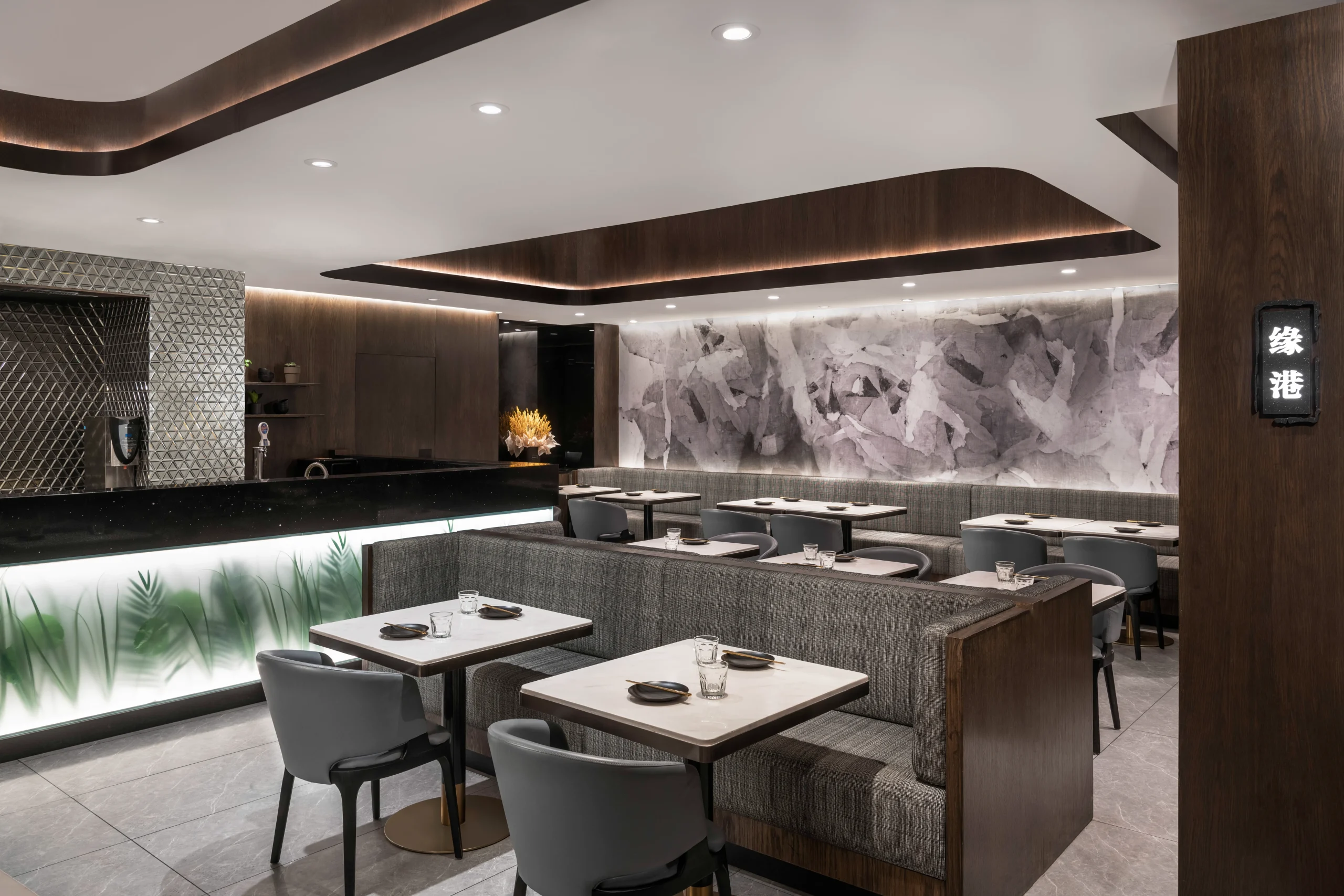 Interior Design - Interior view of a modern restaurant featuring sleek furniture and elegant decor. Dexign Matter Studio