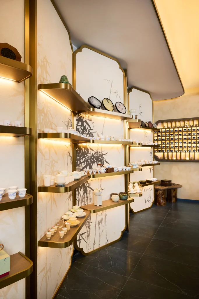 Interior Design - Interior display featuring shelves with various tea products and decorative items. Dexign Matter Studio